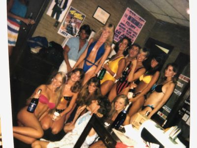 Jed sitting in his bathrobe with KROQ Bikini Girls